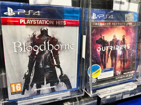 Kyiv, Ukraine - February 09, 2025: PlayStation 4 games Bloodborne and Outriders displayed on store shelves