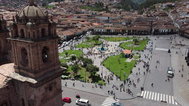 Plaza de armas in cusco, peru, showing tourists walking around