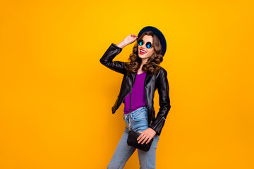 Photo of excited attractive lady holding hand on fabulous retro hat ready for voyage wear stylish outfit with shoulder clutch isolated yellow background