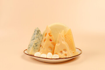 Assortment of different types of cheese, Blue cheese, Roquefort, Parmesan, Mozzarella, Maasdam on a light background, Advertising card for cafe and menu, Healthy and natural choice of food products
