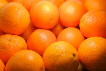 Fresh oranges beautifully lit on counter, close-up of vibrant citrus fruits with healthy nutrition concept perfect for food photography, summer fruit, organic, vitamin c rich, bright citrus freshness