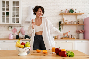 young pretty woman cooking at home, morning kitchen, healthy food