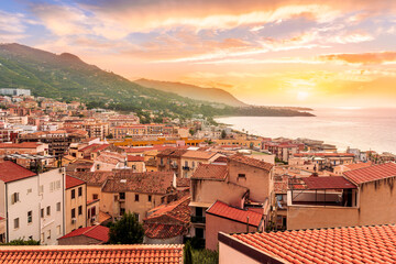 wonderful landscape of beautiful mediterranean sunset town in Italy with orange old tile roofs,...