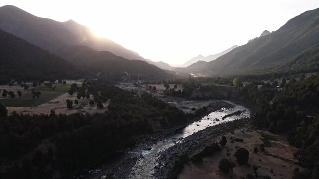 Drone footage of San Fabian town in Chile with river and mountains view