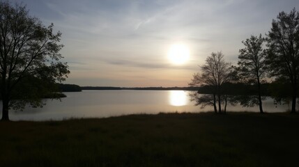 Beautiful Sunset Over Calm Lake Surrounded by Trees and Nature