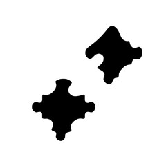 Obraz premium Two black puzzle pieces on a white background.