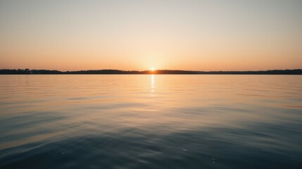 Fototapeta premium Serene Sunset Over Calm Waters Reflecting Golden Light in Nature