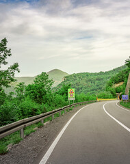 Road with a sign that says 