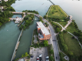 Aerial over Port Dalhousie, Rennie Park and Heywood Generating Station in Martindale Pond alongside Lakeside Park in St. Catharines, Ontario, Canada on a summer afternoon in July, 2024.