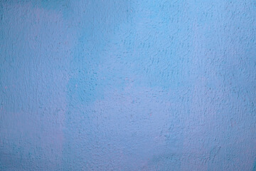 Textured light blue wall background with smooth surface and copy space for design projects