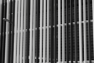 Car parking garage, steel beams in various monochrome colors 