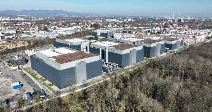 Aerial views on the FRA 4 data centers in Germany. Intenret infrastructure, cloud computing and information technology.