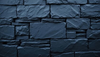 Dark blue slate rock texture background with rough, cracked layers of stone, creating a natural, rugged surface. Ideal for nature, geology, or abstract design projects.