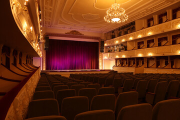 Theatre interior with stage and rows of comfortable seats