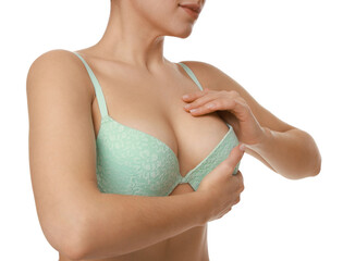 Woman wearing beautiful bra on white background, closeup