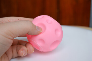hand holding sensory textured ball babies toddlers tactile stimulation sensory play early childhood...