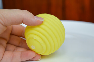 hand holding sensory textured ball babies toddlers tactile stimulation sensory play early childhood...