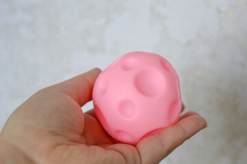 hand holding sensory textured ball babies toddlers tactile stimulation sensory play early childhood...