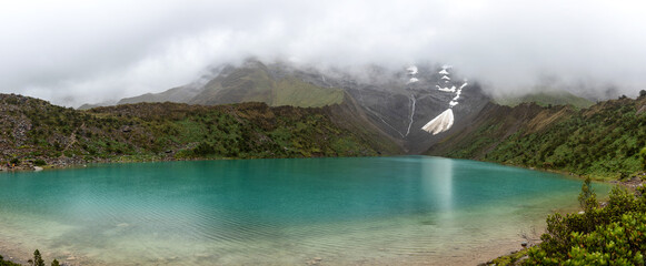 Panorama of Laguna Humantay and melted snow, located in the Peruvian Andes cordillera, and a popular trekking destination