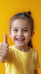 Happy girl giving thumbs up while standing near window on a sunny day