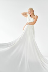 Naklejka premium Woman, body and nude on studio background with white fabric for covering with art deco in confidence.