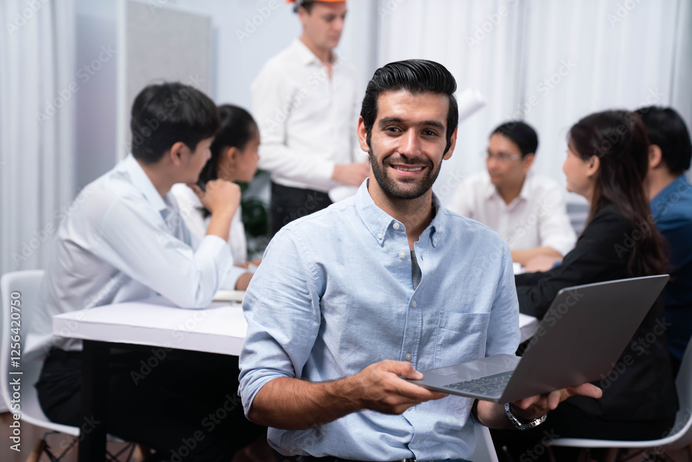 Poster Engineer team leader portrait with diverse group of civil engineer and client working together on architectural project, reviewing construction plan and building blueprint at meeting table. Prudent
