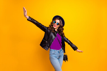 Photo of funny lady spread hands pretending air flight to warm countries wear casual outfit isolated yellow background