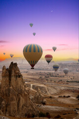Air balloons in Cappadocia at a magnificent sunset. Flying hot air balloons in Cappadocia. Nevsehir,Turkey.