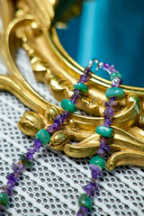 gold necklace on a wooden background