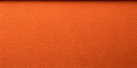 Orange Textured Surface: Close-up of a vibrant orange material with a textured pattern, showcasing depth and warmth in its color and design.