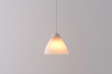 Modern pendant lamp illuminating a minimalist interior space with soft light