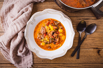Zero waste soup, pizza soup with vegetables and meat, minestrone