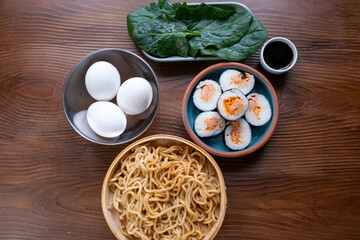 Close-up of dim sum setup sushi,noodles and egg