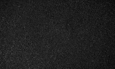 Black foam texture as background. Black foam surface, top view, flat lay