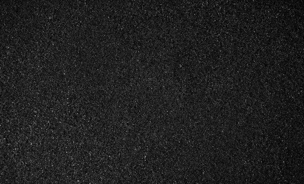 Black foam texture as background. Black foam surface, top view, flat lay
