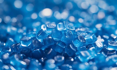 Close-up of translucent blue ice cubes creating a textured cool and refreshing background
