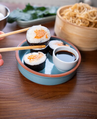 Close-up of dim sum setup sushi,noodles and egg