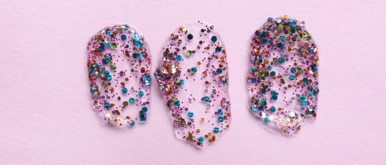 Color glitter strokes on lilac background