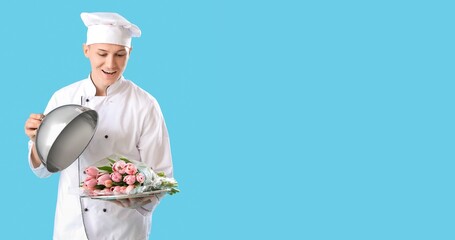 Male chef tulips on light blue background with space for text. International Women's Day celebration