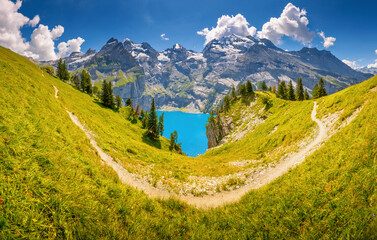 Gorgeous panoramic view of famous Oeschinensee lake in the Bernese Alps. Location place Kandersteg,...