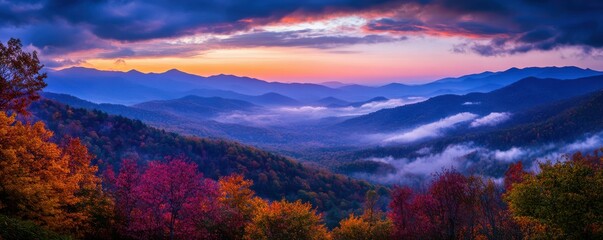 Breathtaking autumn sunrise over misty mountain range in vibrant fall colors