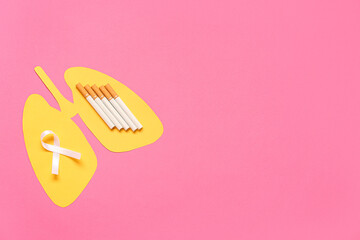 Paper lungs with cigarettes and white ribbon on pink background. Lung cancer concept