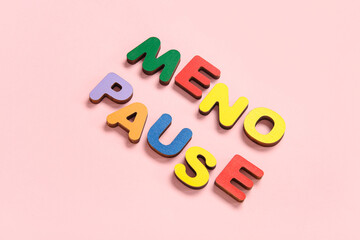 Word MENOPAUSE on pink background