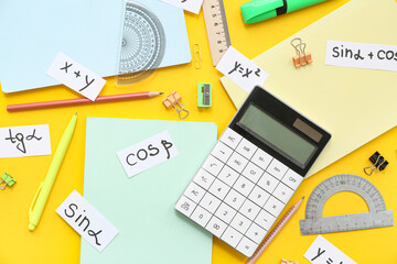 Calculator, school stationery, different math formulas and equations on yellow background