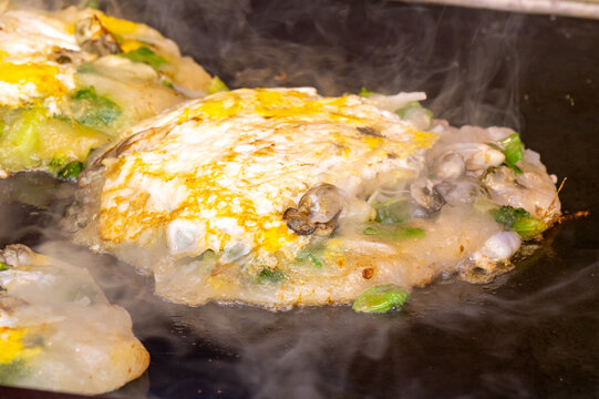 The oyster omelette (o-a-tsian) is a Min Nan dish popular in Taiwan spread by Hokkien and Teochew communities