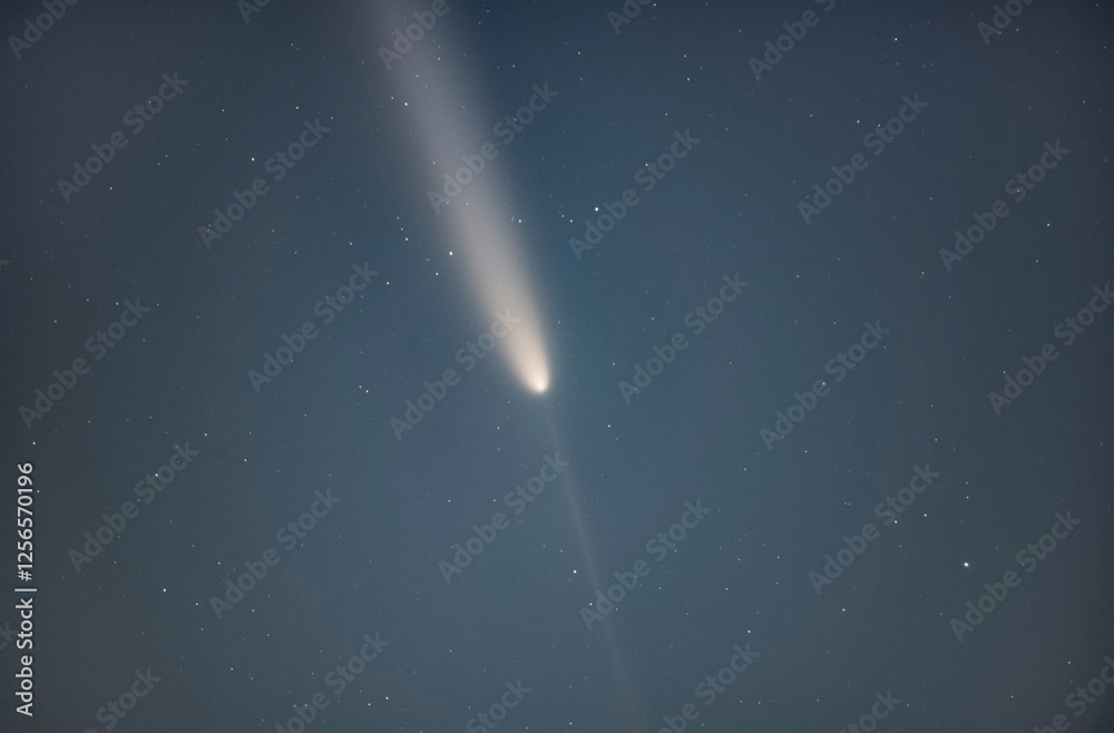 Wall mural comet 2023 a3 tsuchinshan atlas interstellar comet. a comet with a long tail crossing space. comet s