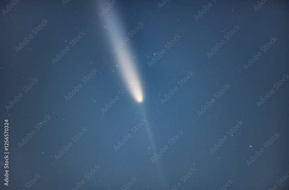 Wall mural comet 2023 a3 tsuchinshan atlas interstellar comet. a comet with a long tail crossing space. comet s