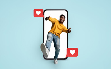 A young person wearing a bright sweater interacts with a smartphone, showcasing heart emojis...