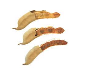 Cutout sour tamarind on white background. The variety with a sour taste comes from tartaric acid. Fresh pods are used in cooking to add sourness, mature pods are used to make tamarind paste.