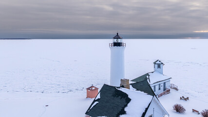 Winter aerial view Tibbetts Point Lighthouse on the shore of Lake Ontario, at the entrance of the...